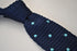 knitted navy blue tie with light blue polka dots